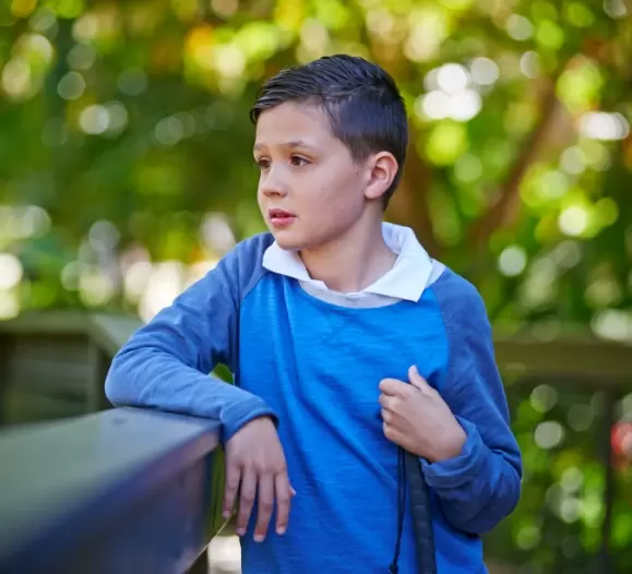 Grant recipient happy in outdoor setting